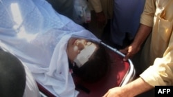 Pakistani hospital workers carry injured Malala Yousafzai attacked by gunmen in Mingora on October 9, 2012.