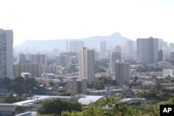 Diamond Head, an extinct volcanic crater, and high-rises are seen in Honolulu on Saturday, Jan. 13, 2018.