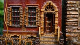 A miniature brownstone building is displayed during preparations for the annual Holiday Train Show in New York City, November 11, 2021.