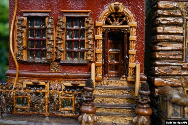 A miniature brownstone building is displayed during preparations for the annual Holiday Train Show in New York City, November 11, 2021.