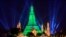The stupa of the Buddhist temple Wat Arun (Temple of Dawn) is illuminated in green to mark St. Patrick's Day in Bangkok.
