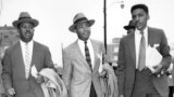 FILE - The Rev. Ralph Abernathy (L), Rev. Dr. Martin Luther King, Jr. (C), and Bayard Rustin, leaders in the racial bus boycott in Montgomery, Ala., leave the Montgomery County Courthouse on Feb. 24, 1956. 