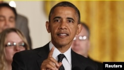 U.S. President Barack Obama delivers a statement on the U.S. "Fiscal Cliff" in the East Room of the White House, November 9, 2012. 