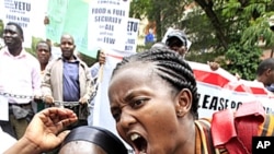 Members of Kenya's civil society chant slogans during a demonstration outside the Parliament Buildings in Nairobi, April 19, 2011