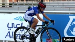 FILE - Israeli cyclist Paz Bash, wearing a conventional hard foam helmet, competes during the Women Elite Road Race at the UCI Road World Championships, in Doha, Qatar, Oct. 15, 2016. Tests have shown that new inflatable helmets offer more protection. 