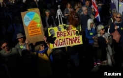 FILE - Protesters participate in an anti-Brexit demonstration march through central London, Britain Oct. 20, 2018.