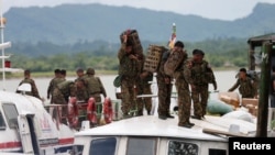 FILE - Myanmar soldiers arrive at Buthidaung jetty after Arakan Rohingya Salvation Army (ARSA) attacks at Buthidaung, Myanmar, Aug. 29, 2017. 