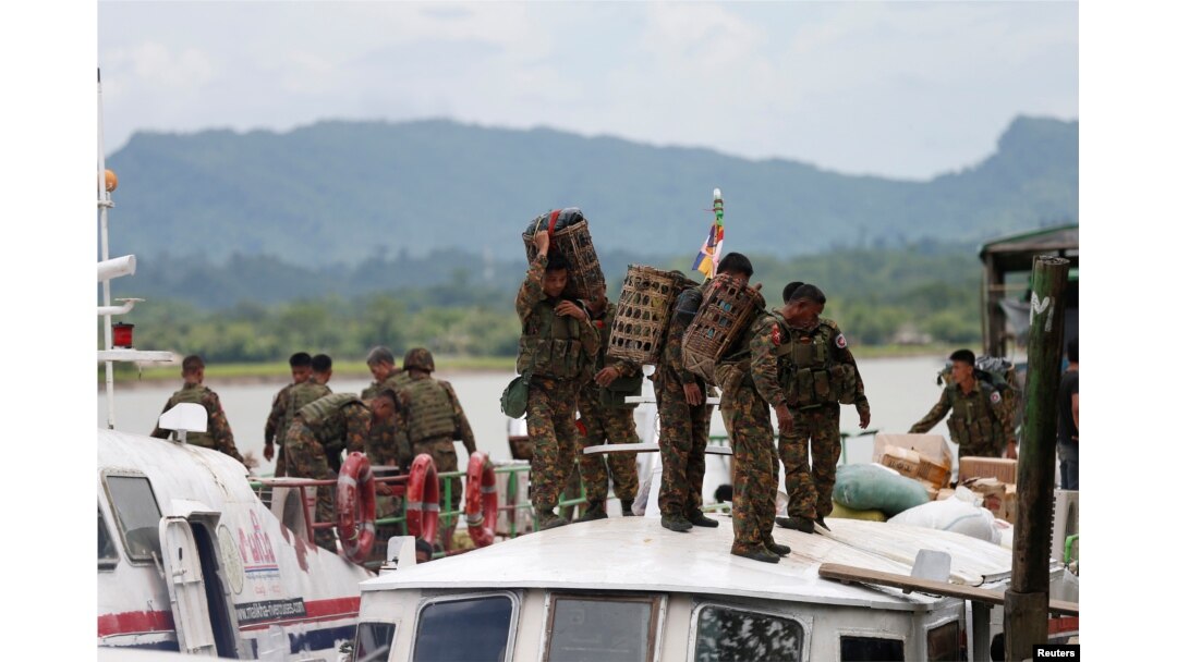 FILE - Myanmar soldiers arrive to Buthidaung jetty after Arakan Rohingya Salvation Army's (ARSA) attacks, at Buthidaung, Myanmar, Aug. 29, 2017.
