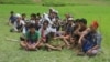 FILE - People gather near mass grave sites near Yebawkya village, Kamaungseik Township in Maungdaw District, Northern Rakhine State, Sept. 27, 2017. (Moe Zaw and Sithu Naing/VOA Burmese)