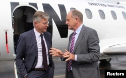 FILE - Jean-Pierre Lacroix, United Nations' under-secretary-general for peacekeeping operations, left, is received by David Shearer, head of the UN Mission in South Sudan (UNMISS), upon arriving in Juba, South Sudan, Aug. 1, 2017.