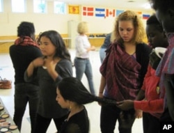 Members of the Pihcintu Multicultural Children's Chorus primp before practice.