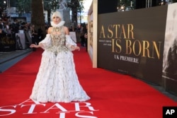 Actress and singer Lady Gaga poses for photographers upon arrival at the premiere of the film 'A Star Is Born' in London, Thursday, Sept. 27, 2018.