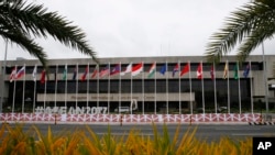 Flags flutter outside the Philippine International Convention Center, the venue for the 50th Association of Southeast Asian Nations Foreign Ministers' Meeting and its regional partners, Aug. 2, 2017 in suburban Pasay city, Philippines. 