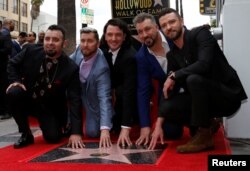 American boy band *NSYNC pose during the unveiling ceremony of their star on the Hollywood Walk of Fame in Los Angeles, April 30, 2018.