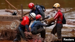 Members of a rescue team search for victims of a collapsed tailings dam owned by Brazilian mining company Vale SA in a vehicle on Paraopeba River, in Brumadinho, Brazil, Feb. 5, 2019. 