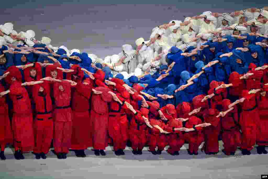 Artists in the colors of Russia perform at the Fisht Olympic Stadium during the opening ceremony of the 2014 Winter Paralympic Games in the Black Sea resort of Sochi.