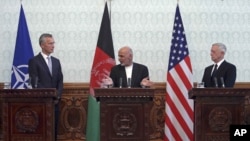 Afghan President Ashraf Ghani, center, speaks during a press conference with U.S. Defense Secretary Jim Mattis, right, and NATO Secretary General Jens Stoltenberg at the presidential palace in Kabul, Afghanistan, Sept. 27, 2017.