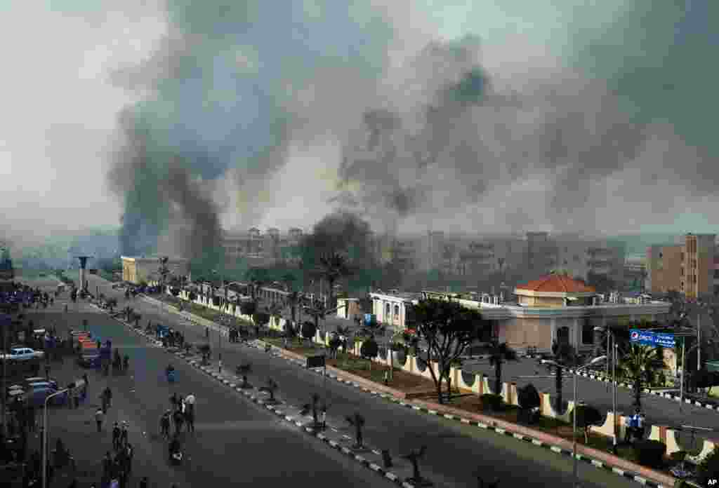 Smoke rises after Egyptian protesters clash with police, unseen, in Port Said, Egypt, January 27, 2013. 