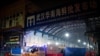 中国湖北省武汉市卫生应急队的消毒车辆驶离已被关闭的武汉华南海鲜批发市场。（2020年1月11日）