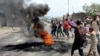 Demonstrators burn tires to set up barricades during a protest in the Democratic Republic of Congo's capital Kinshasa, Jan. 20, 2015.