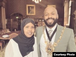 Magid Magid, left, a former refugee who has taken over as Sheffield's Lord Mayor, stands with Kaltum Osman, a Somali-born city councilor, after his inauguration. (Photo courtesy of the office of Magid Magid)