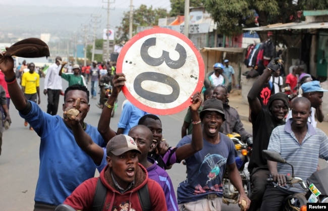 Supporters of Kenyan opposition leader Raila Odinga of the National Super Alliance (NASA) coalition protest against the treason charges on lawyer Miguna Miguna in the streets of Kisumu, Kenya, Feb. 6, 2018.