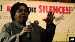 A relative of a victim of extrajudicial killings recounts her experience at a rally in Nairobi, March 8, 2011