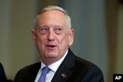 Defense Secretary Jim Mattis responds to a reporter's question during a meeting with Libyan Prime Minister Fayez Serraj at the Pentagon, Nov. 30, 2017.