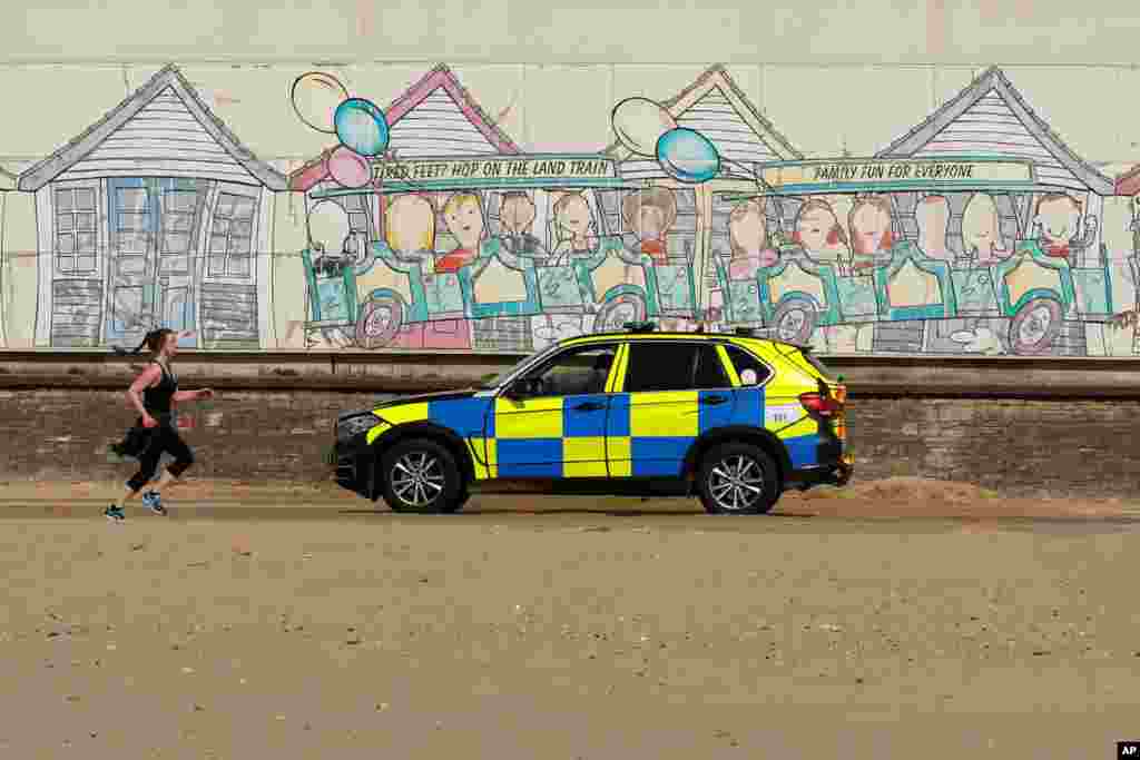 Police are seen on Bournemouth beach in Britain as the spread of the coronavirus disease (COVID-19) continue.