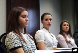 Kaylee Lorincz, from left, Rachael Denhollander and Lindsey Lenke, all victims of Dr. Larry Nassar speak after a plea hearing in Lansing, Mich., Wednesday, Nov. 22, 2017. Nasser, a sports doctor accused of molesting girls while working for USA Gymnastics