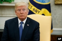 President Donald Trump in the Oval Office of the White House, Oct. 10, 2017, in Washington.