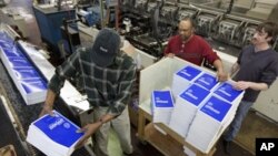 Government Printing Office (GPO) employees work on copies of President Barack Obama's fiscal 2013 budget book, Feb. 9, 2012
