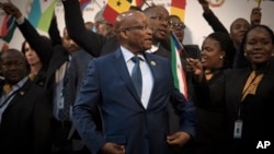 FILE - South African President Jacob Zuma, center, gathers with delegates at the opening session of the AU summit in Johannesburg, June 14, 2015. 