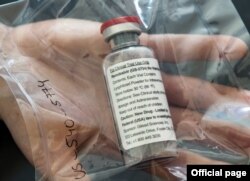 (FILES) In this file photo one vial of the drug Remdesivir is viewed during a press conference about the start of a study with the Ebola drug Remdesivir in particularly severely ill patients at the University Hospital Eppendorf (UKE) in Hamburg, northern