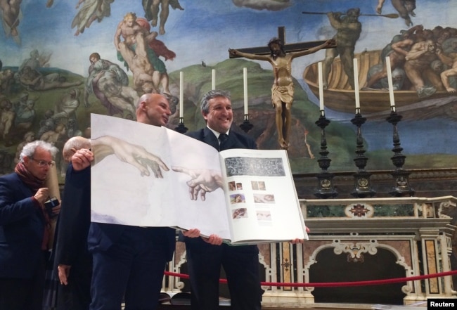 A 1:1 scale photographic book depicting Sistine Chapel is seen during a news conference in the Sistine Chapel, the Vatican, Feb. 24, 2017.