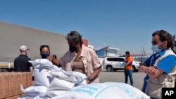 Linda Thomas-Greenfield, U.S. Ambassador to the United Nations, examines aid materials at the Bab al-Hawa border crossing between Turkey and Syria. (File)