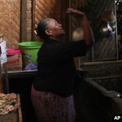 Yoto, who used to own two large homes, lives in a makeshift camp for volcano eruption survivors. She can no longer live in her village, which is entirely buried by the volcanic ash.