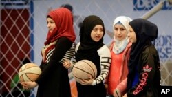 Syrian refugee girls attend a basketball training session at a private sports club, southern Beirut, Lebanon, Feb. 19, 2017.