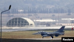 FILE - A Turkish Air Force F-16 fighter jet lands at Incirlik Air Base in Adana, Turkey, Aug. 11, 2015.