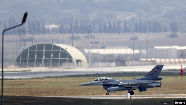 FILE - A Turkish Air Force F-16 fighter jet lands at Incirlik Air Base in Adana, Turkey, Aug. 11, 2015.