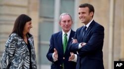 French President Emmanuel Macron (right) Paris mayor Anne Hidalgo and former mayor of New York City Michael Bloomberg talk during their meeting at the Elysee Palace in Paris, June 2, 2017.