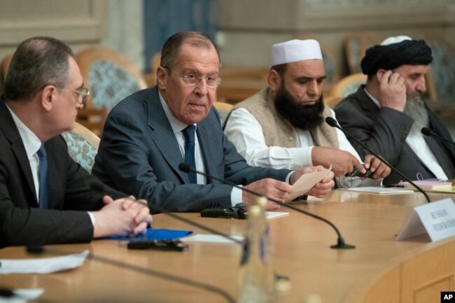 Russian Foreign Minister Sergey Lavrov, second left, speaks as he attends a conference on Afghanistan bringing together representatives of the Afghan authorities and the Taliban in Moscow, Russia, Nov. 9, 2018.