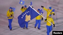 Albin Tahiri of Kosovo carries the national flag during the opening ceremony of the Pyeongchang 2018 Winter Olympic Games at the Pyeongchang Stadium, Pyeongchang, SouthKorea, Feb. 9, 2018.