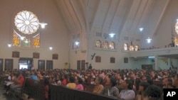 Christian worshippers fill St. Theresia Church for Easter Sunday services, Central Jakarta, Indonesia, April 24, 2011