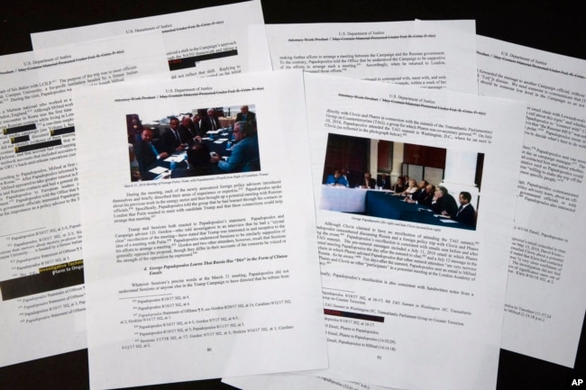 FILE - Special counsel Robert Mueller's redacted report on the investigation into Russian interference in the 2016 presidential election is photographed in Washington, April 18, 2019.