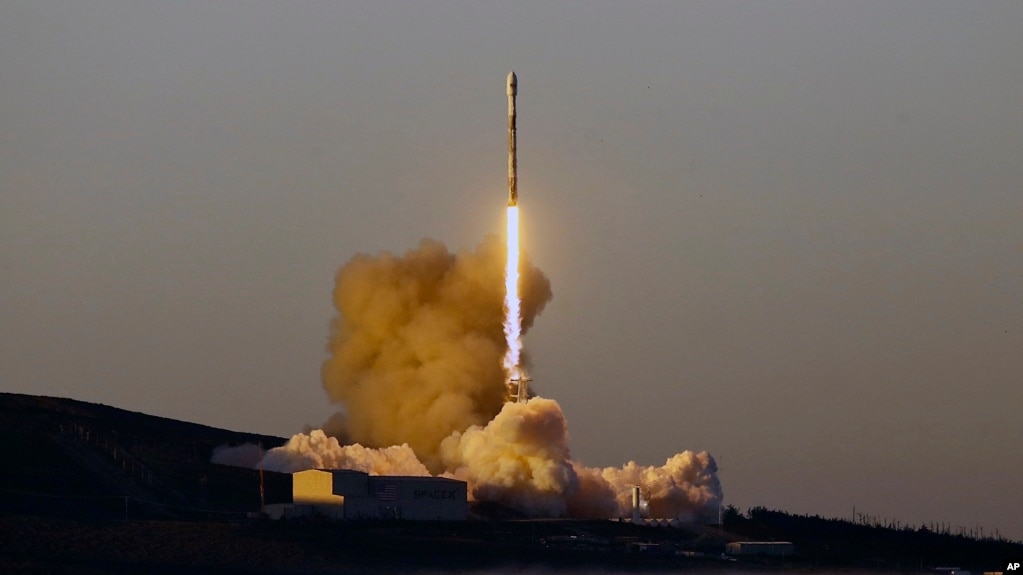 FILE - A Falcon 9 rocket lifts off from Vandenberg Air Force Base, Calif., March 30, 2018. On Friday, a SpaceX rocket launched 10 more voice and data satellites for Iridium Communications, which is replacing its entire fleet with a new generation of orbiters.