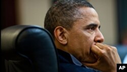 President Barack Obama listens during one in a series of meetings discussing the mission against Osama bin Laden, in the Situation Room of the White House, May 1, 2011.