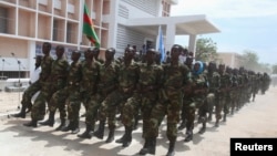 Somali government forces march during a parade to celebrate the 53rd anniversary of the national army, in the capital Mogadishu, April 12, 2013.