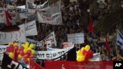 Thousands of Israelis march during a protest against the rising cost of living in Israel, in central Tel Aviv , Israel, Saturday, Aug. 6, 2011.