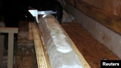 FILE - An ice core is seen at the Vostok camp in Antarctica in this April 5, 2010 handout photograph.